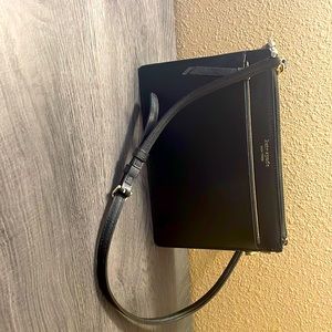 Small Kate Spade crossbody purse black with gold hardware.